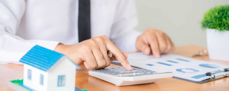 Real estate broker agent presenting and consult to customer to decision making sign insurance form agreement, home model, concerning mortgage loan offer for and house insurance.
